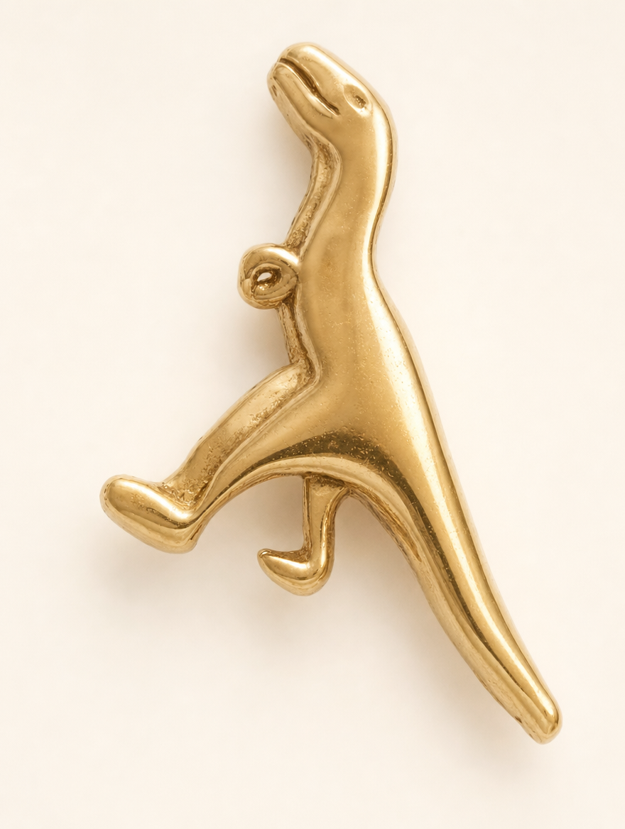 Broquel T-Rex Oro 10K — macro de la forma