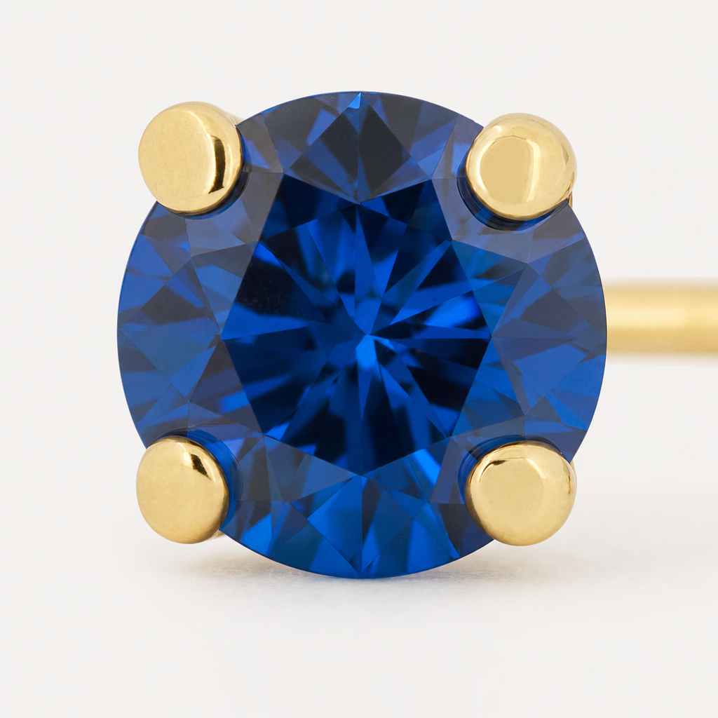 Broquel Solitario Zirconia Azul 3 mm Oro 10K — macro frontal
