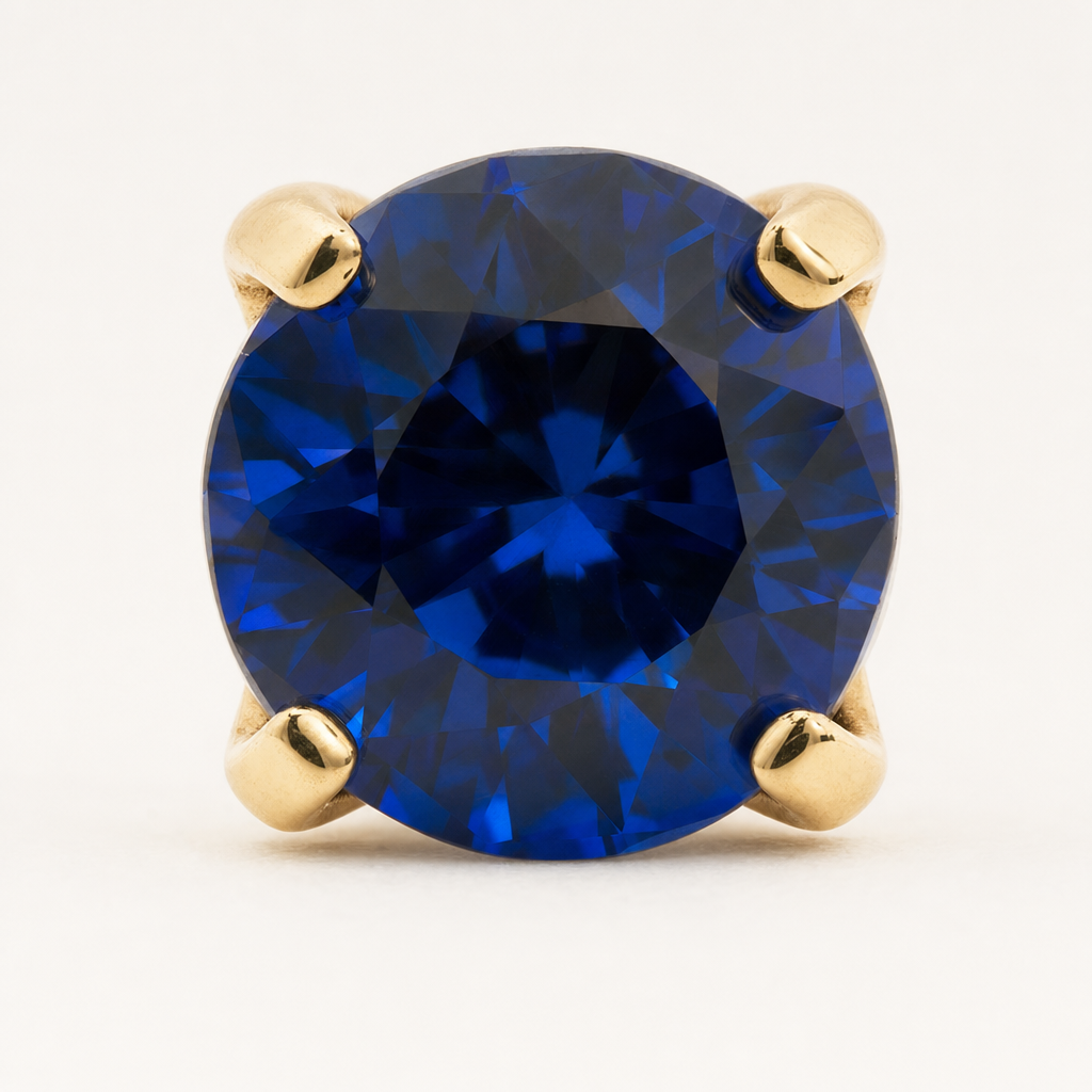 Broquel Solitario Zirconia Azul 4 mm Oro 10K — macro frontal
