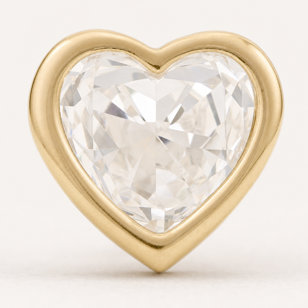 Broquel Bisel Corazón Zirconia 4 mm Oro 10K — macro frontal