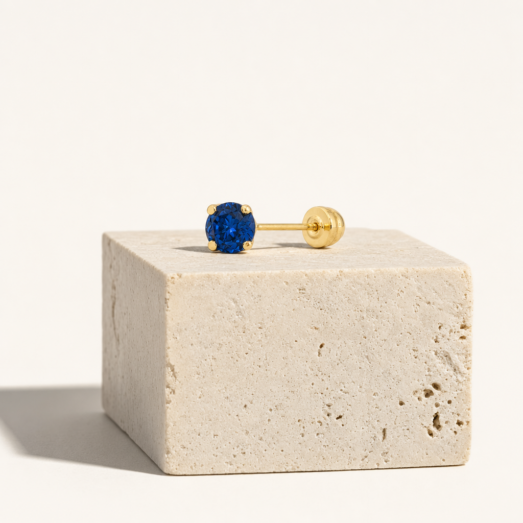 Broquel Solitario Zirconia Azul 3 mm Oro 10K — bodegón editorial