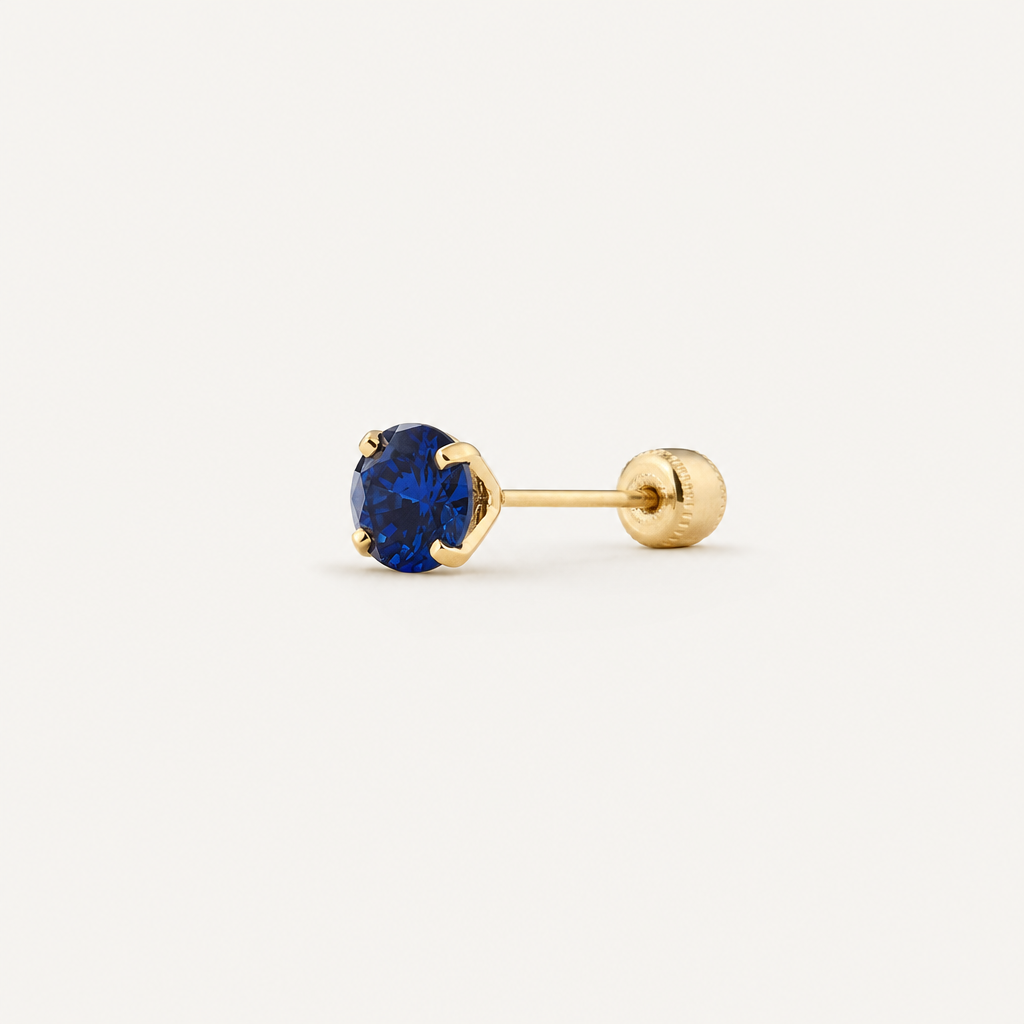 Broquel Solitario Zirconia Azul 4 mm Oro 10K — vista diagonal