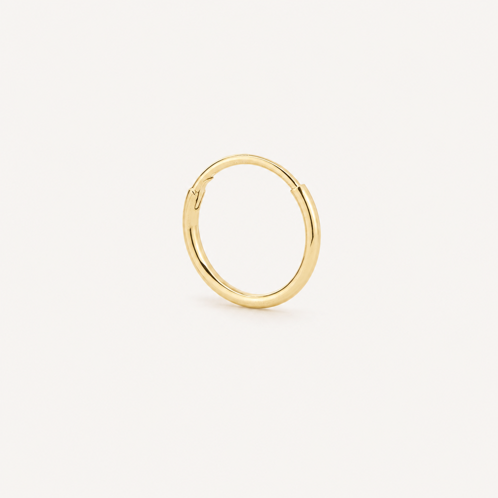 Arracada Lisa 6.6 mm Oro 10K — vista diagonal
